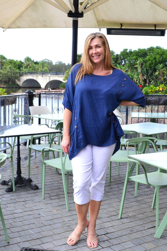 Navy blue coconut button sloping sleeve tunic top by Wishstone, featuring a loose fit and stylish design, displayed on a hanger.