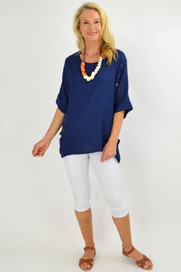 Navy blue Wishstone coconut button sloping sleeve tunic top with a relaxed fit and stylish design, displayed on a hanger.