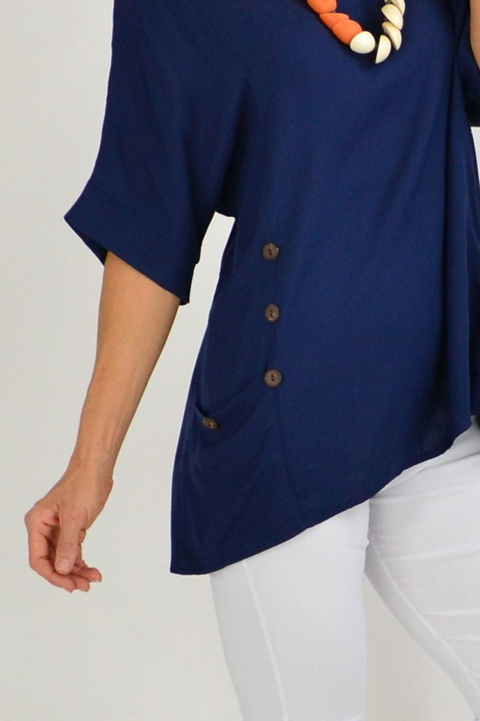 Navy blue Wishstone coconut button sloping sleeve tunic top with relaxed fit and sloped sleeves, displayed on a hanger.