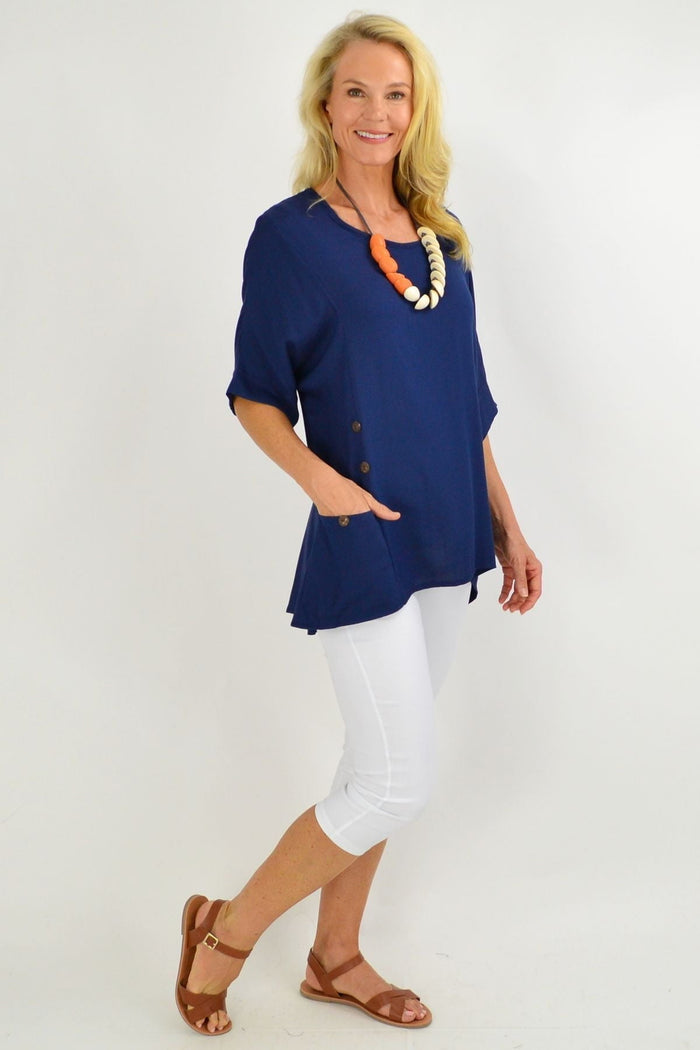 Navy blue Wishstone tunic top with coconut buttons and sloping sleeves, casual and stylish women's clothing.