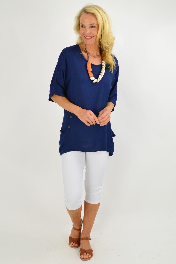 Navy blue Wishstone tunic top with coconut buttons and sloping sleeves, casual and stylish for women.