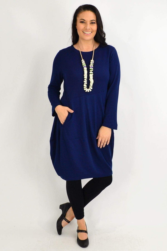 Navy blue cocoon winter pocket tunic dress by Peony, showing its relaxed fit, side pockets, and cozy fabric detail.