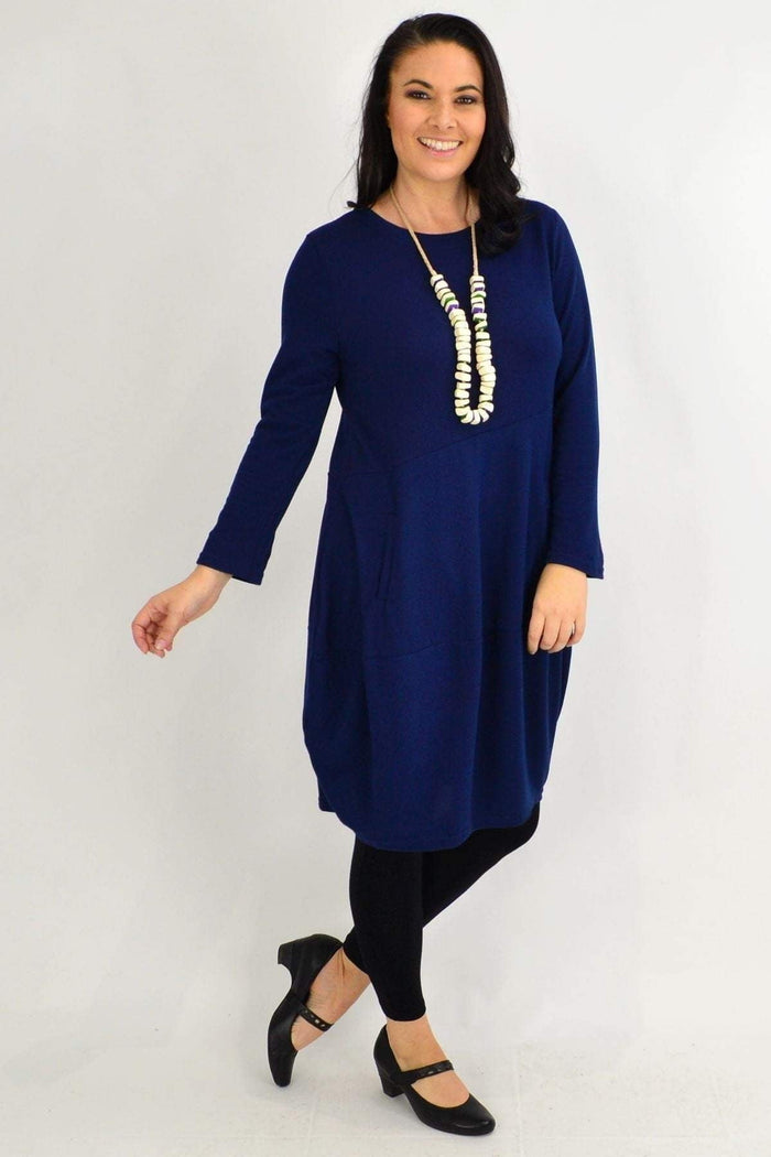 Navy blue Peony cocoon winter pocket tunic dress displayed on a hanger, showcasing its relaxed fit and cozy fabric.