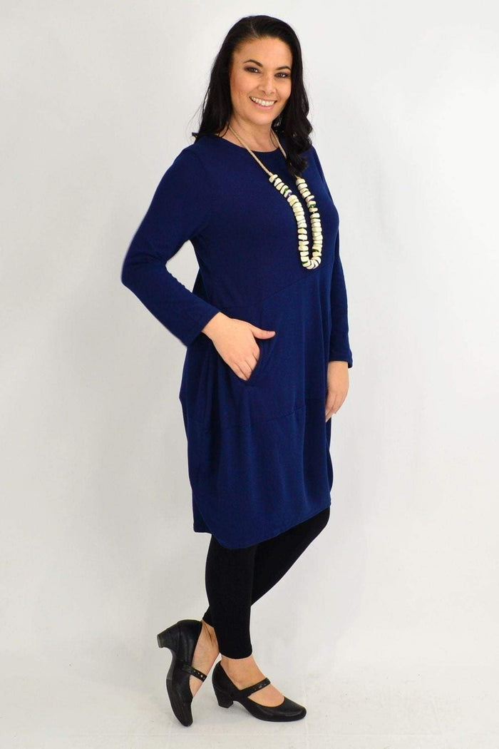Navy blue Peony cocoon winter pocket tunic dress displayed on a hanger with pockets and a relaxed fit.