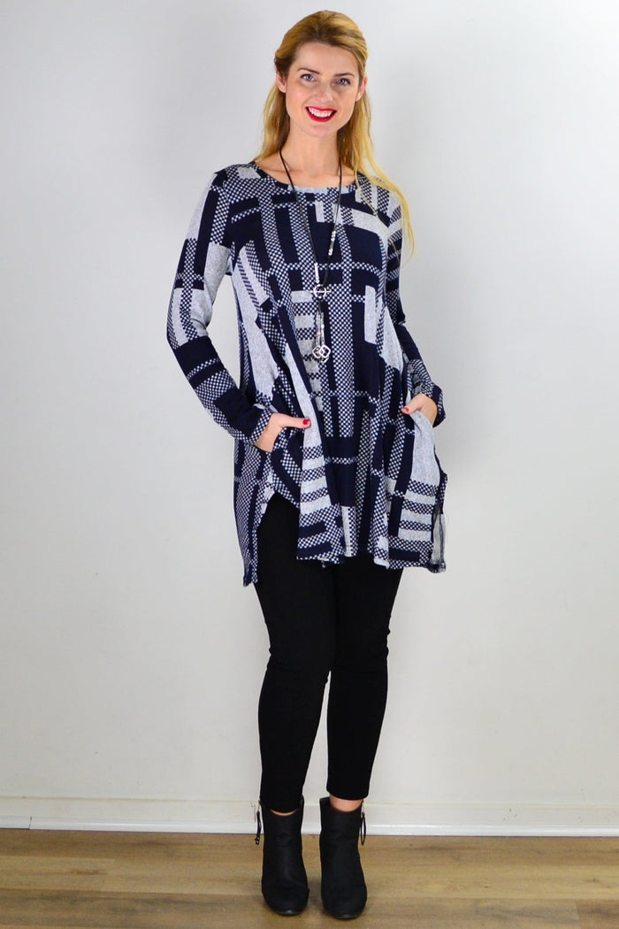 Navy blue and grey knit tunic top by Hourglass, featuring a cozy, stylish design with long sleeves and a relaxed fit.