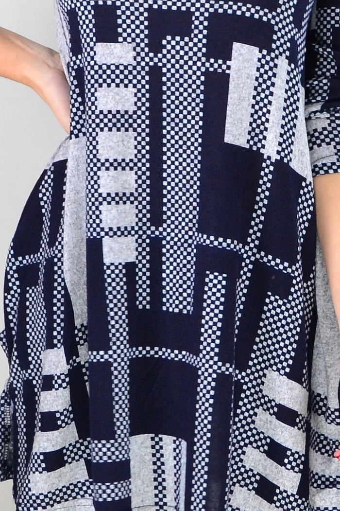 Navy blue and grey knit tunic top by Hourglass, featuring a relaxed fit and soft fabric, displayed on a hanger.
