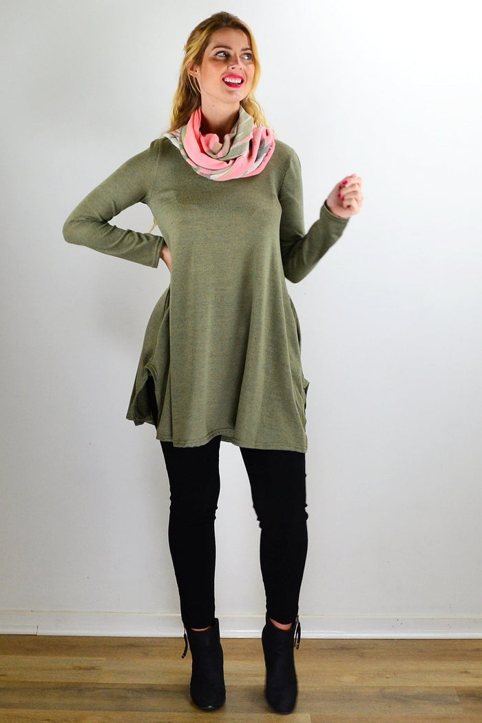 Olive green knit tunic top by Hourglass, featuring a relaxed fit and textured fabric, displayed on a hanger.