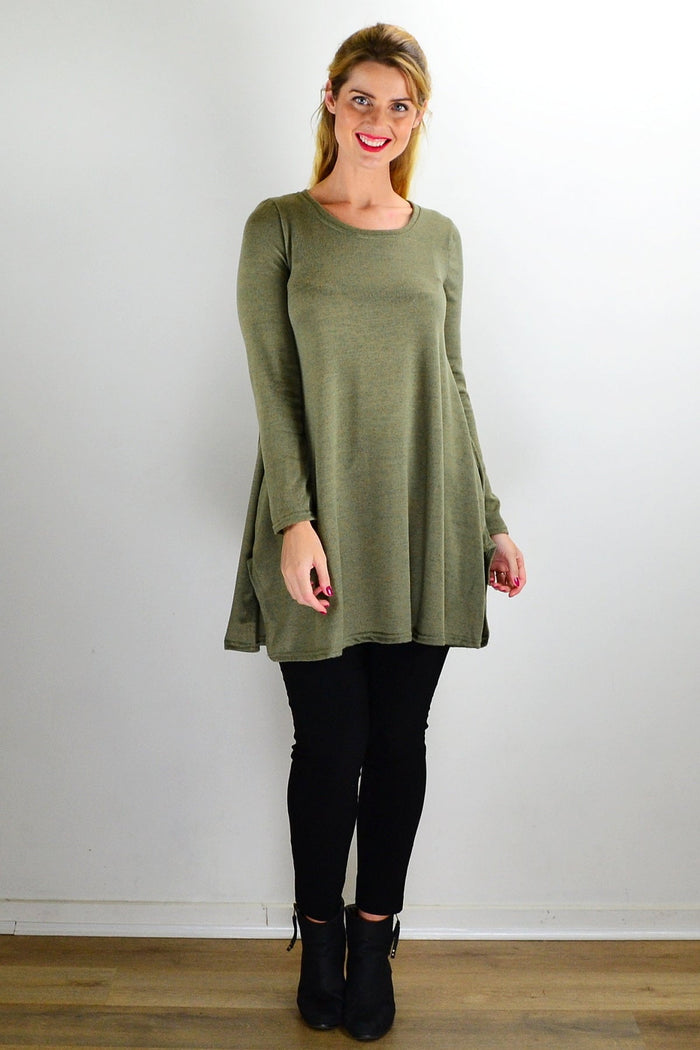 Olive green knit tunic top by Hourglass displayed on a hanger with a relaxed fit and long sleeves.