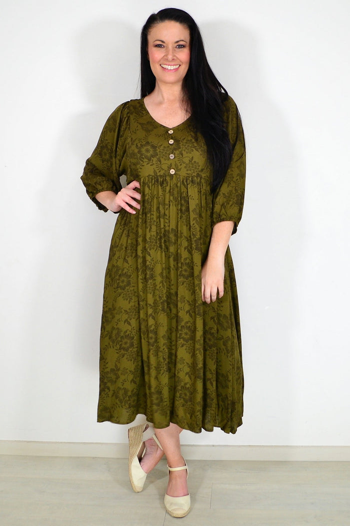Olive green Willow Tree peasant tunic dress with long sleeves and relaxed fit, displayed on a hanger against a white background.