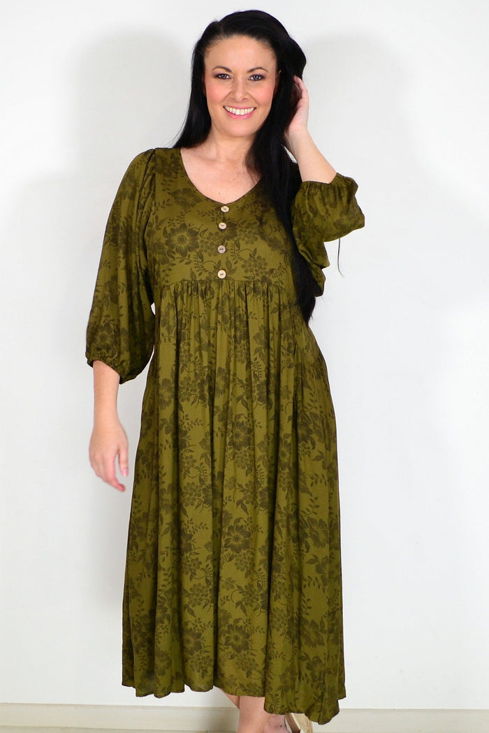 Olive green Willow Tree peasant tunic dress with flowing fabric and relaxed fit, displayed on a hanger.