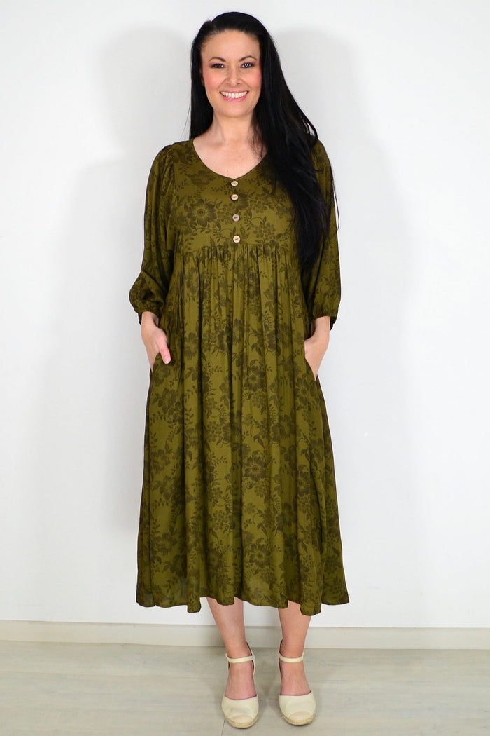 Olive green Willow Tree peasant tunic dress with long sleeves and relaxed fit, displayed on a hanger.