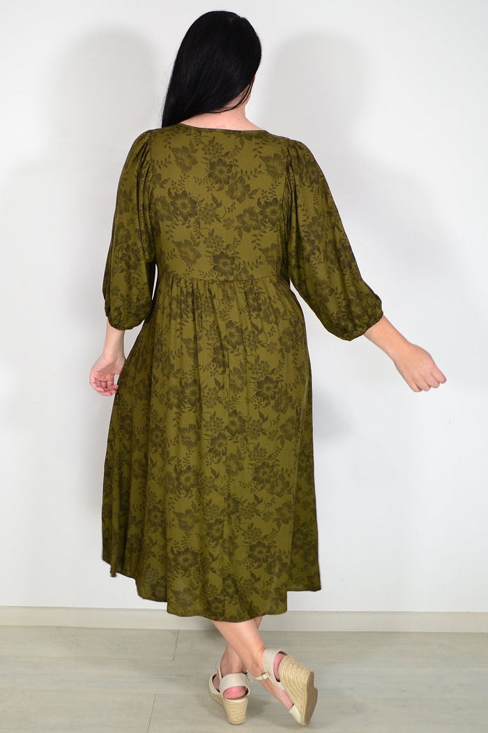 Olive green Willow Tree peasant tunic dress with flowing fabric and relaxed fit, displayed on a hanger.