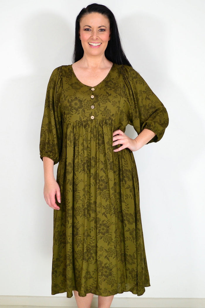 Olive green Willow Tree peasant tunic dress with flowing fabric and relaxed fit, displayed on a hanger.
