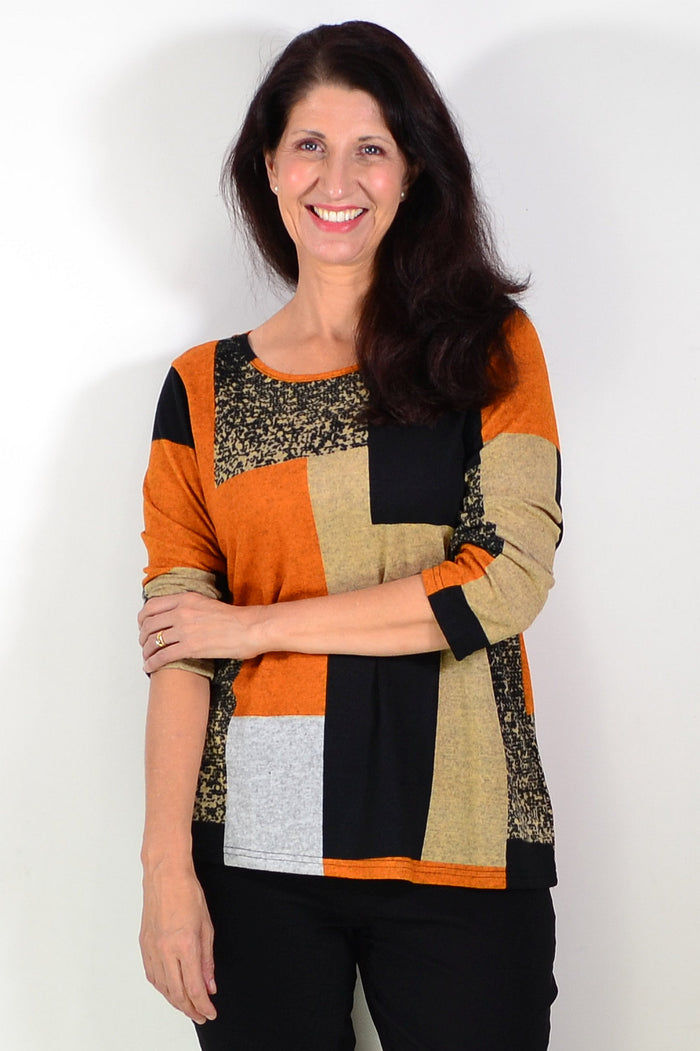 Orange and black geometric print tunic top by Hourglass, featuring a stylish and comfortable design with a flowing silhouette.