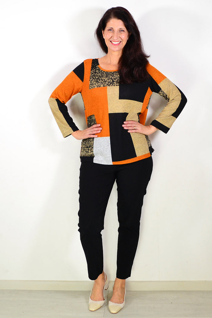Orange and black geometric print tunic top by Hourglass, featuring a stylish and comfortable design with bold patterns.