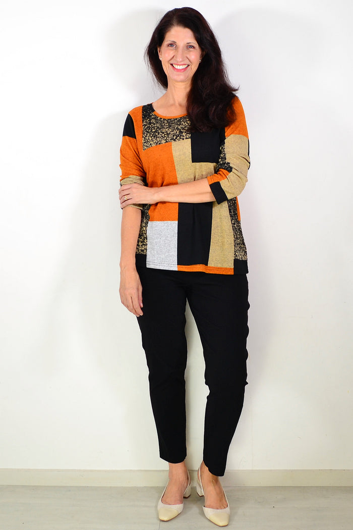 Orange and black geometric print tunic top by Hourglass, featuring a stylish and comfortable design for casual wear.