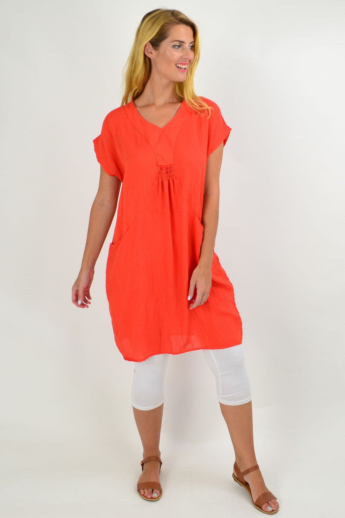 Orange Willow Tree tunic dress featuring a relaxed fit and vibrant color, perfect for casual or stylish wear.