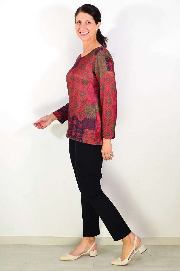 Red Oriental print tunic top by Hourglass, featuring vibrant patterns and a relaxed fit, perfect for casual and stylish wear.