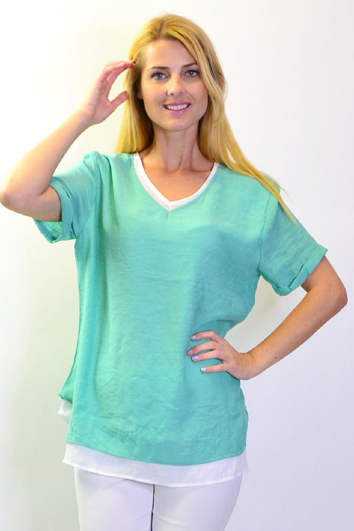 Envogo peppermint slice tunic top displayed on a hanger, featuring a vibrant, sleeveless design perfect for casual wear.