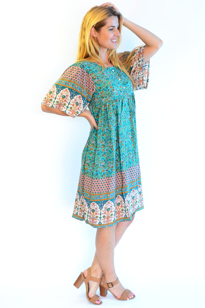 Bohemian green Persian Palace bell sleeve tunic dress by Hourglass, featuring intricate patterns and a relaxed fit.