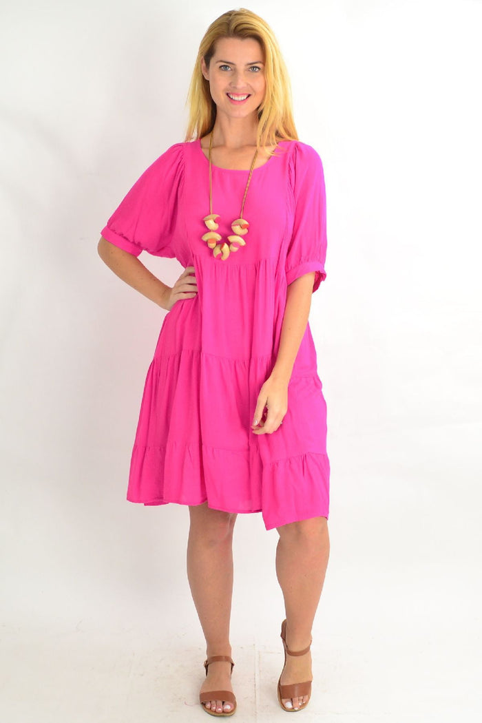 Pink Willow Tree tiered tunic dress with a relaxed fit and summer style, featuring flowing fabric and a feminine design.