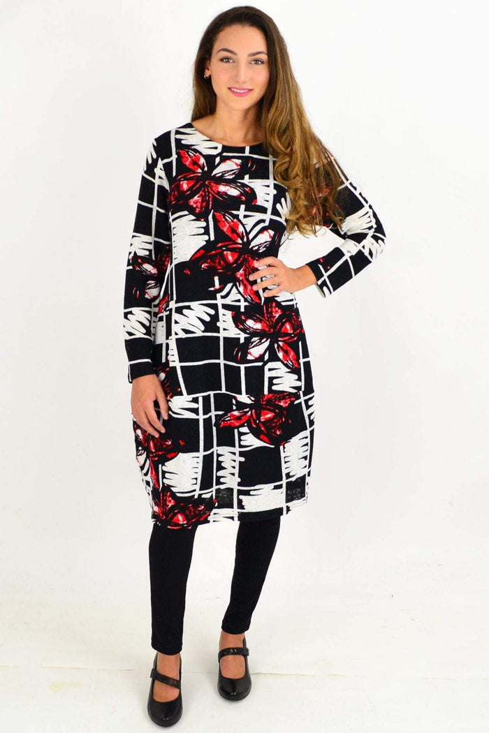 Vuios red butterfly cocoon tunic dress displayed on a hanger, showcasing its flowing fabric and relaxed fit.
