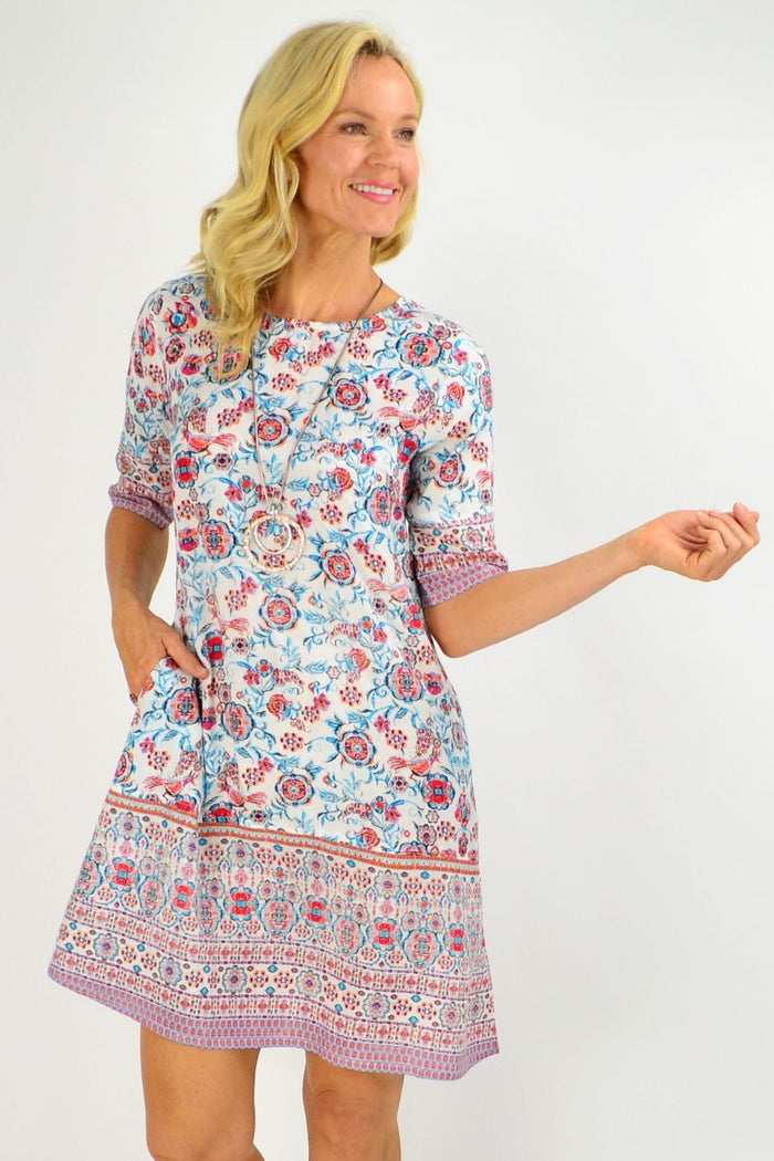 Orientique Ronda Shift Tunic Dress in vibrant floral print, featuring a relaxed fit with long sleeves and a scoop neckline.