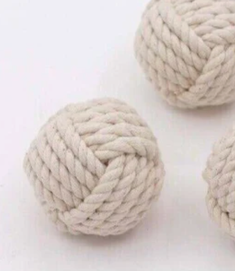 Three beige rope balls with a nautical design, displayed against a white background.