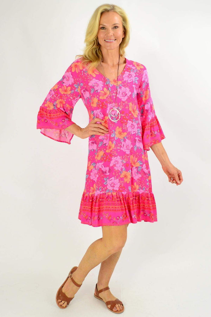 Rose pink Lottie Tier Tunic Dress from Boho Australia featuring floral patterns and a relaxed fit, displayed on a mannequin.