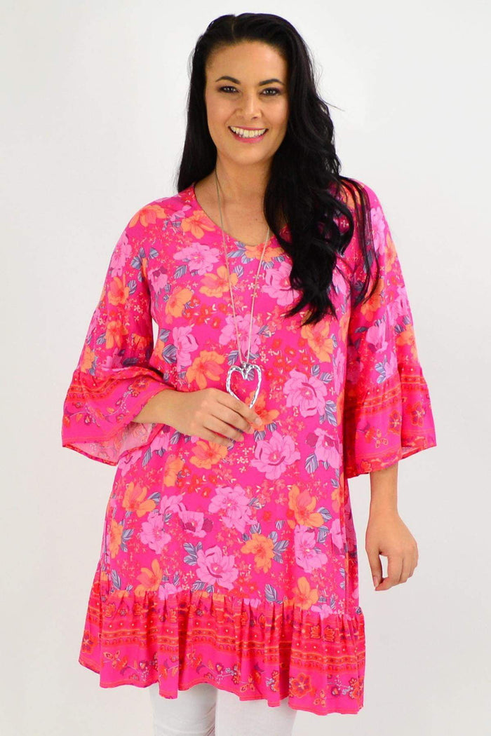 Pink floral Lottie Tier Tunic Dress by Boho Australia, featuring a flowy silhouette and tiered design.