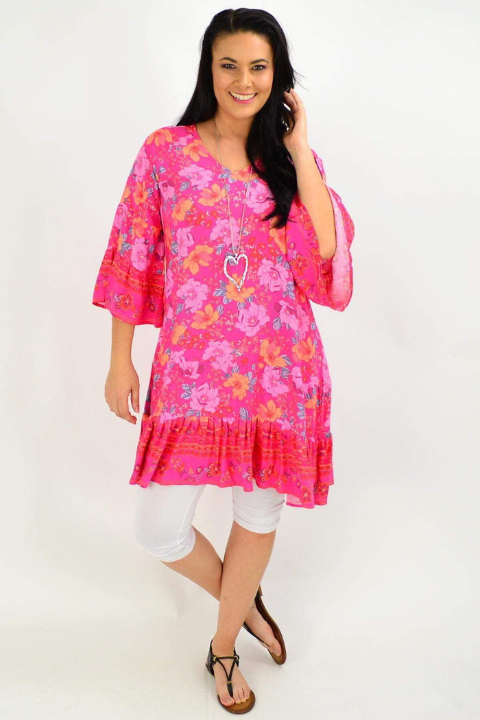 Pink floral Lottie Tier Tunic Dress by Boho Australia, featuring a relaxed fit with tiered layers and floral patterns.