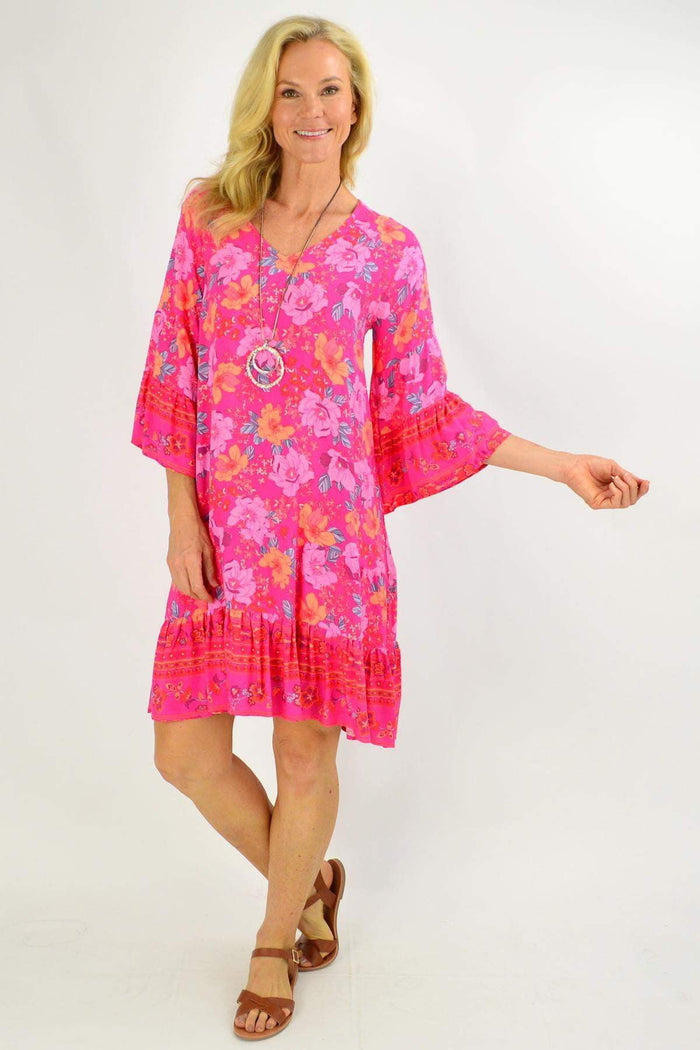 Rose pink Lottie Tier Tunic Dress by Boho Australia with floral pattern, flowing fabric, and tiered design, perfect for boho style.