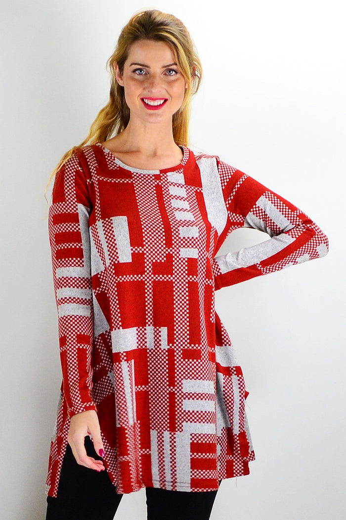 Rust grey knit tunic top by Hourglass, featuring a cozy, textured fabric and relaxed fit, displayed on a hanger.