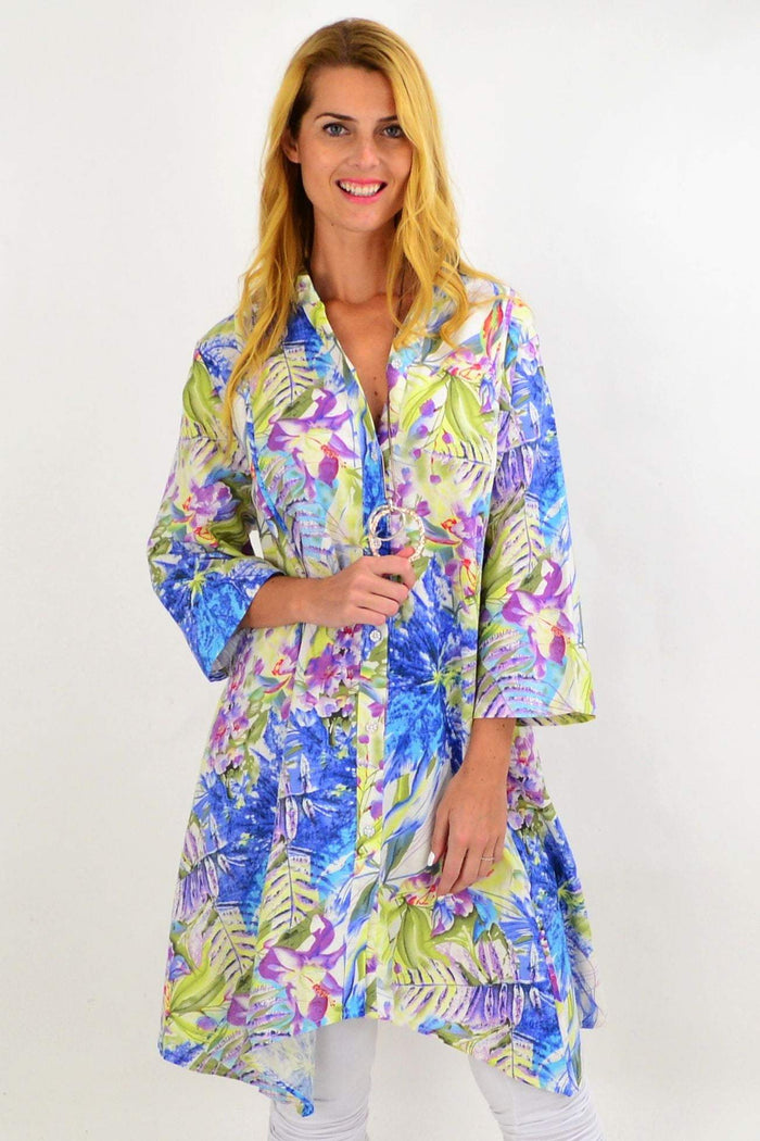 Colorful spring flowers print on Hourglass long tunic shirt with stand collar, featuring vibrant palm designs and a relaxed fit.