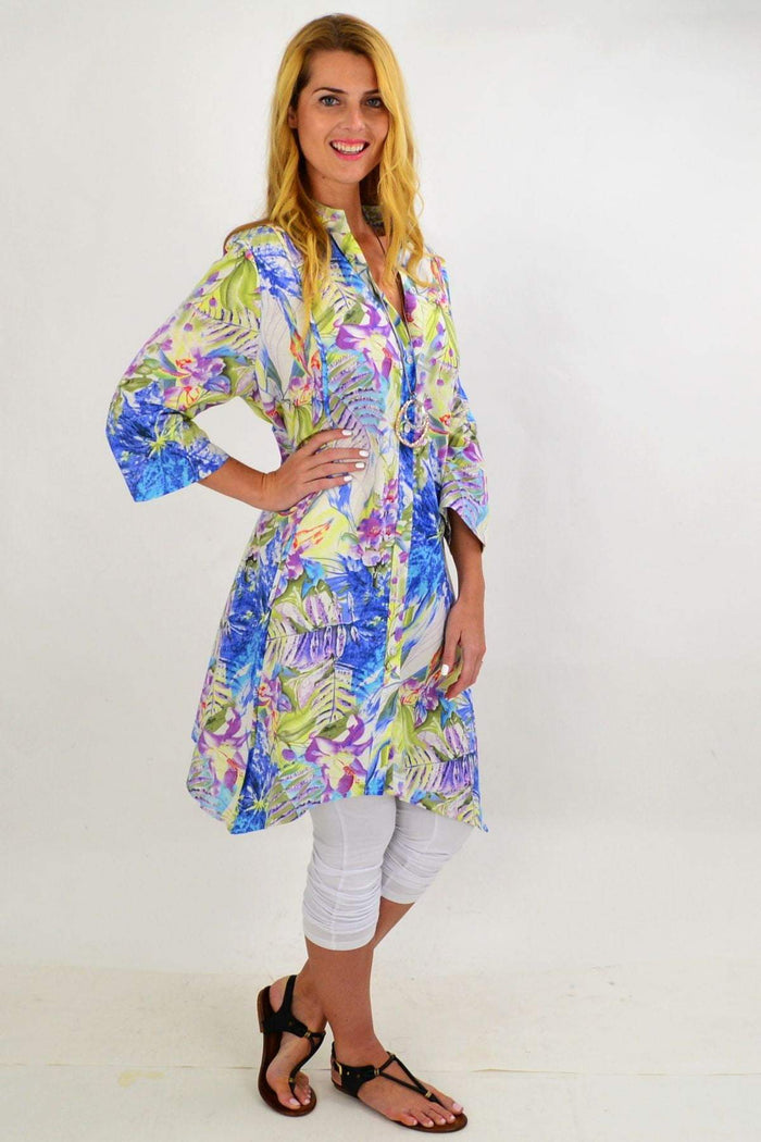 Colorful spring flowers stand collar long tunic shirt by Hourglass with vibrant palm print and relaxed fit.