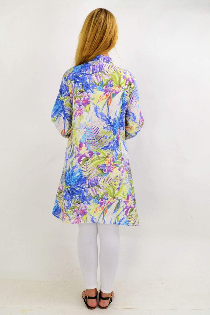 Colorful palm print Spring Flowers stand collar long shirt tunic by Hourglass displayed on a hanger.