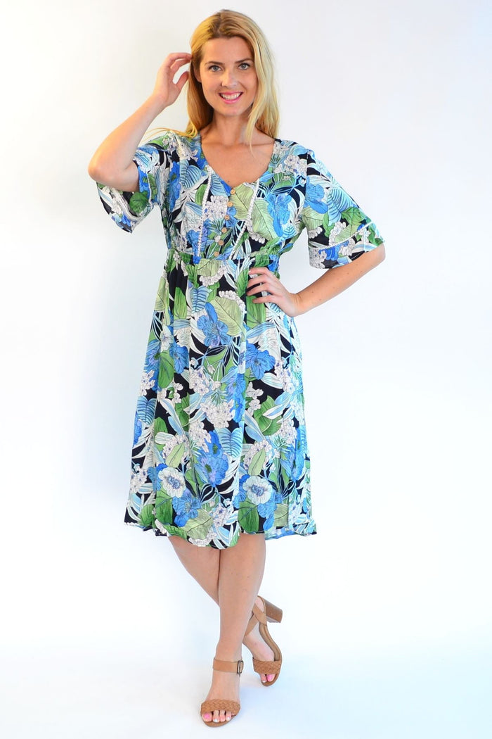Tropical Lace Trim Aztec Haze Zen Garden tunic dress with lace accents and vibrant pattern, displayed on a hanger.