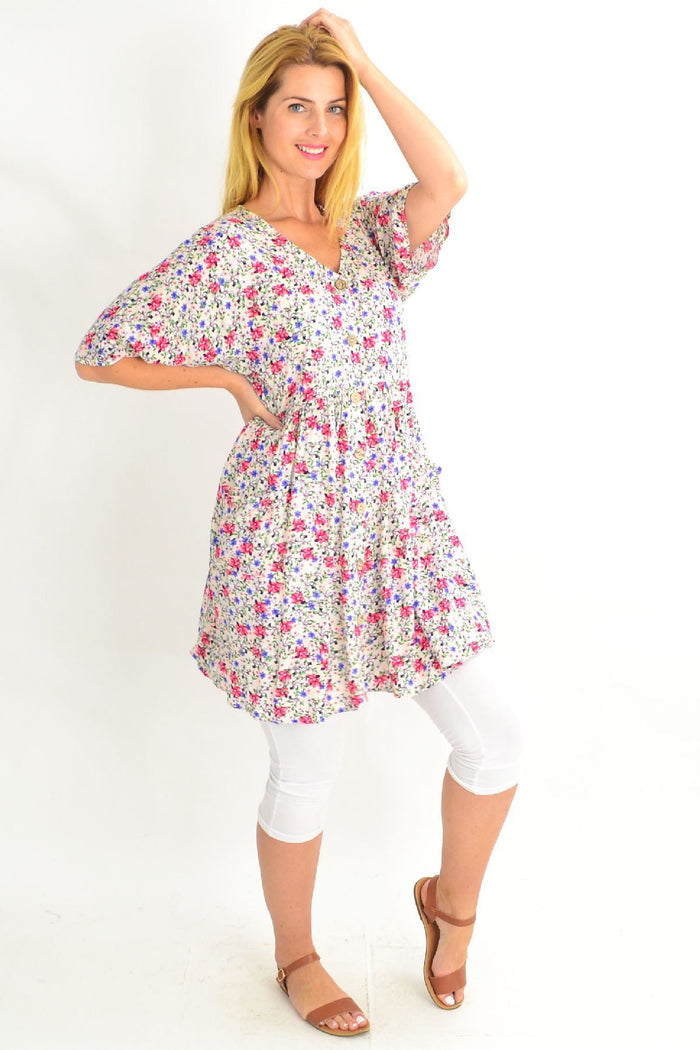 White coconut button pocket tunic dress by Silver Wishes, featuring a relaxed fit, front pockets, and a round neckline.