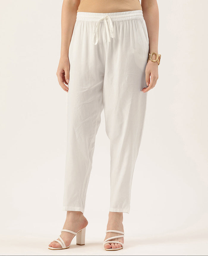 Person wearing white pants on a plain background, White Solid Pencil Pant