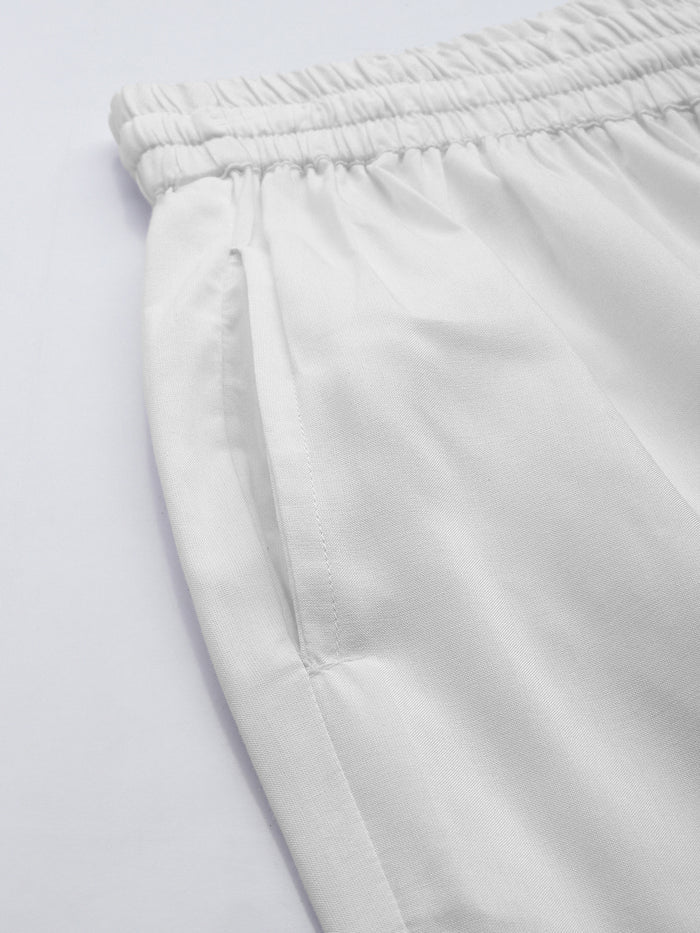 Person wearing white pants on a plain background, White Solid Pencil Pant