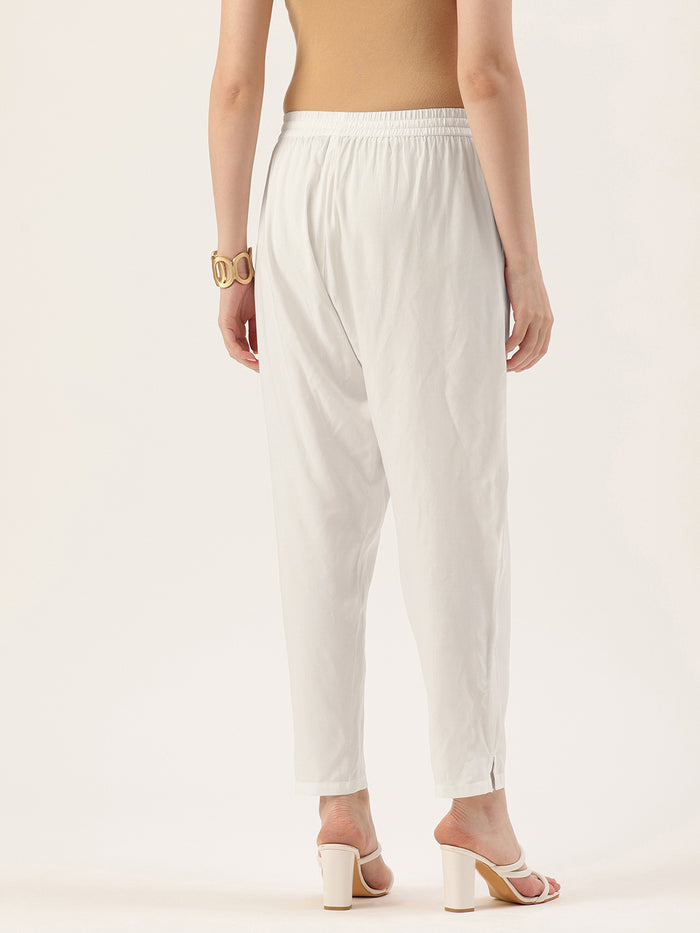 Person wearing white pants on a plain background, White Solid Pencil Pant