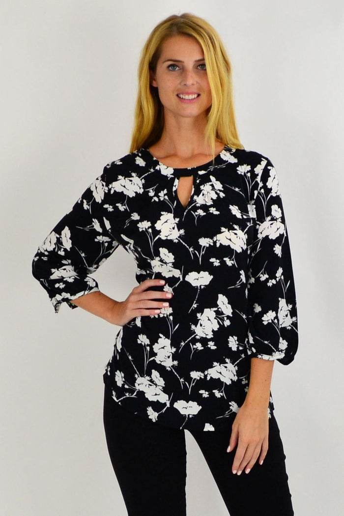 White flower print tunic by Envogo featuring a stylish black and white floral design, perfect for casual or semi-formal wear.