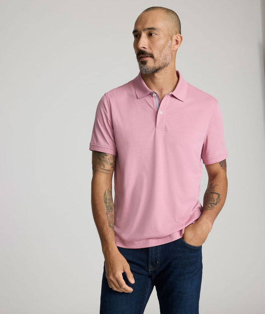 Model is wearing UNTUCKit Wrinkle-Free Damaschino Polo in dark pink.