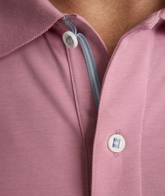 Model is wearing UNTUCKit Wrinkle-Free Damaschino Polo in dark pink.