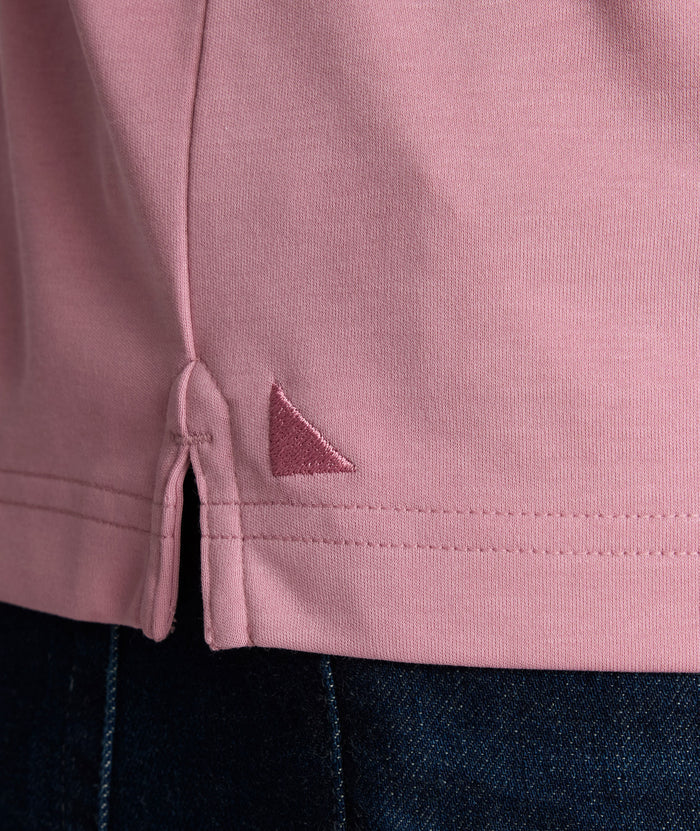 Model is wearing UNTUCKit Wrinkle-Free Damaschino Polo in dark pink.