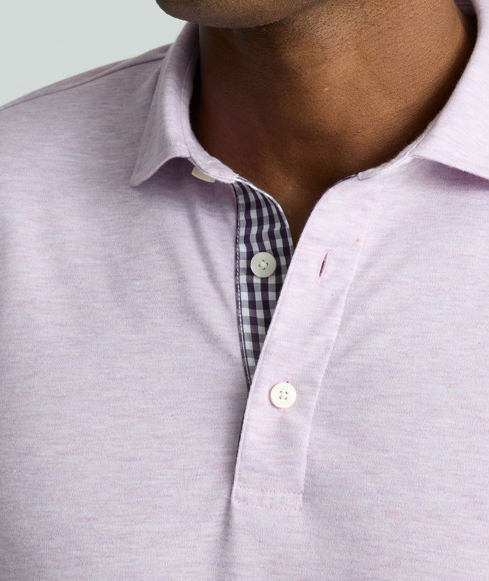 Model is wearing UNTUCKit Wrinkle-Free Long-Sleeve Polo in Heather Lavendula.