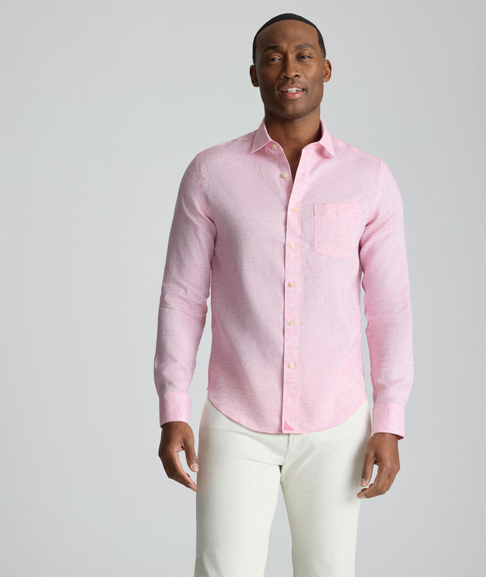 Model is wearing UNTUCKit Wrinkle-Resistant Linen Wildehart Shirt in pink.