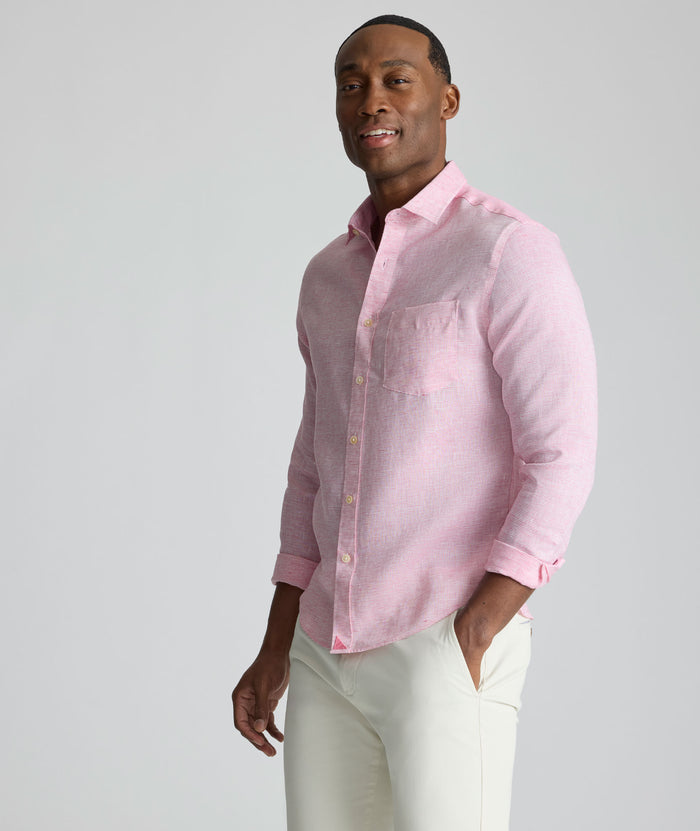 Model is wearing UNTUCKit Wrinkle-Resistant Linen Wildehart Shirt in pink.