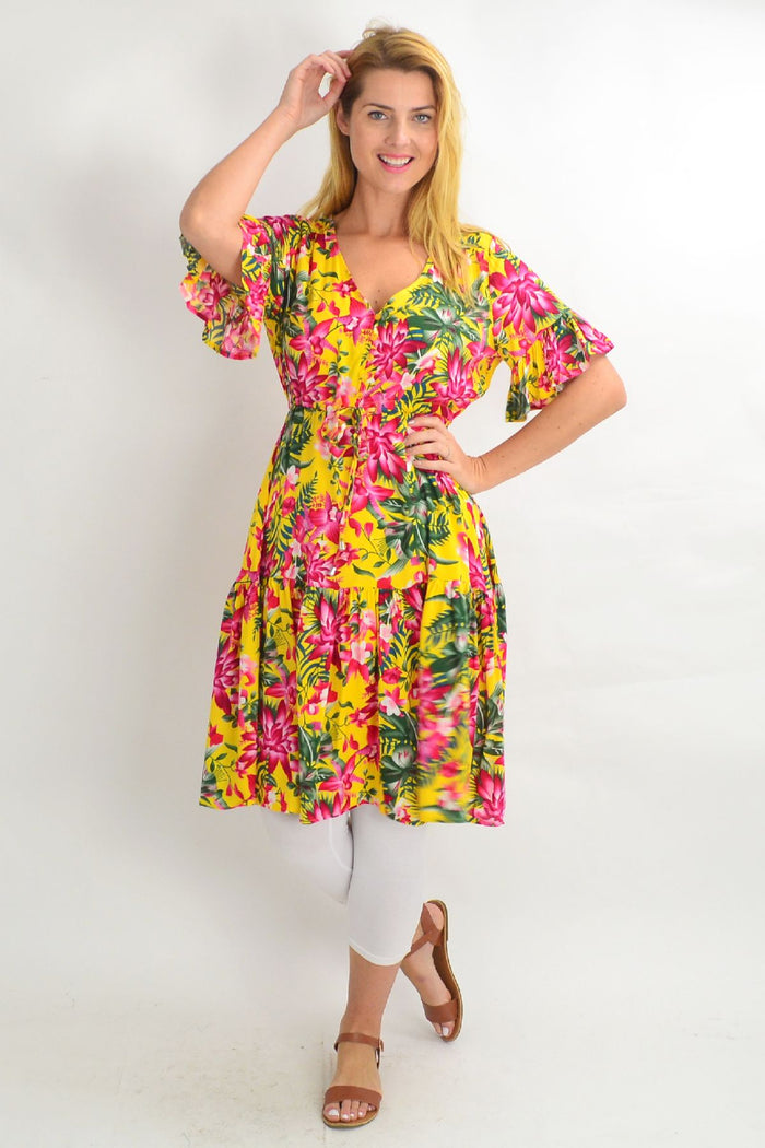 Yellow frilly orchid tunic dress by Willow Tree featuring floral patterns and a flowy, feminine design.