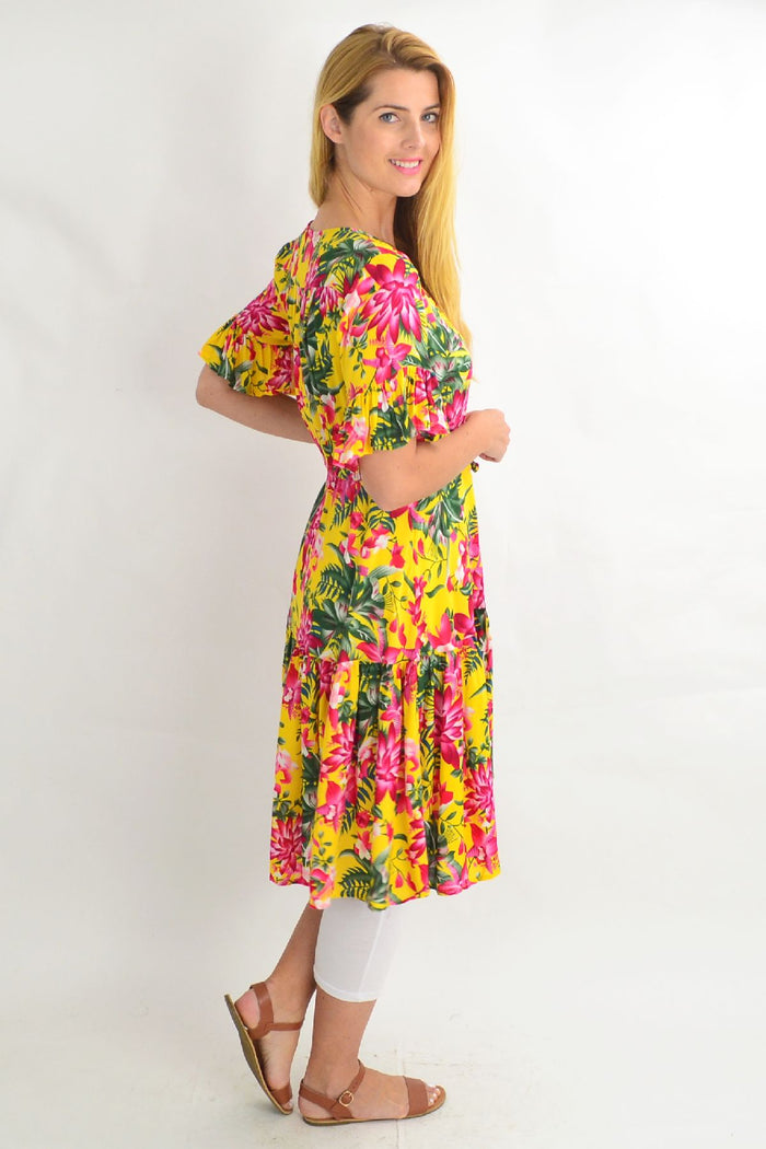 Yellow frilly orchid tunic dress with pink floral pattern, sleeveless design, and lightweight fabric from Willow Tree.
